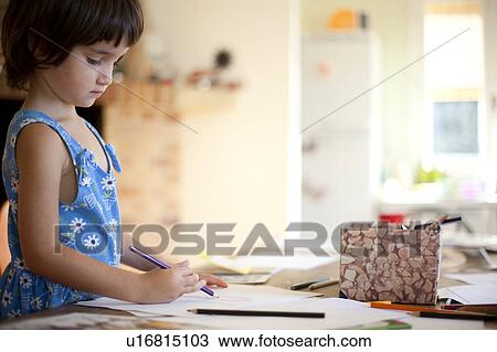 little girl drawing at kitchen table View Large Photo Image Stock Image - little girl drawing at kitchen table. Fotosearch