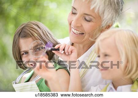little girl examines something carefully View Large Photo Image Stock Image - little girl examines something carefully. Fotosearch
