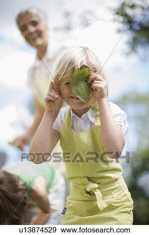 little girl in garden View Large Photo Image Stock Photo - little girl in garden. Fotosearch