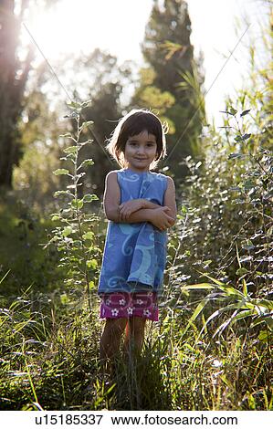 little girl in the fields View Large Photo Image Stock Photo - little girl in the fields. Fotosearch