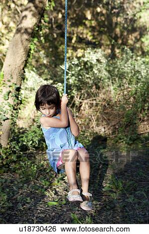 little girl on swing View Large Photo Image Stock Photograph - little girl on swing. Fotosearch