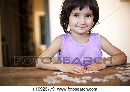 little girl puzzling View Large Photo Image Stock Photo - little girl puzzling. Fotosearch