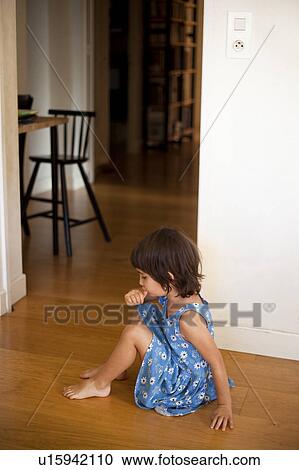 little girl sitting on the floor View Large Photo Image Stock Image - little girl sitting on the floor. Fotosearch