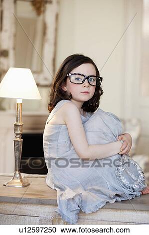 little girl wearing huge pair of glasses View Large Photo Image Stock Image - little girl wearing huge pair of glasses. Fotosearch