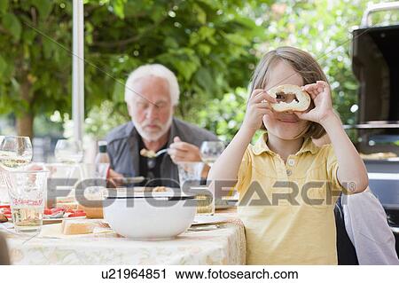 little girl with peace of bread View Large Photo Image Stock Image - little girl with peace of bread. Fotosearch