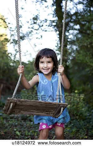 little girl with swing, laughing View Large Photo Image Stock Image - little girl with swing, laughing. Fotosearch