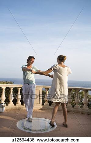 loving couple dance on balcony View Large Photo Image Stock Photograph - loving couple dance on balcony. Fotosearch