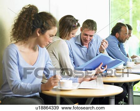 Stock Photo - Lunch time at the office. Fotosearch