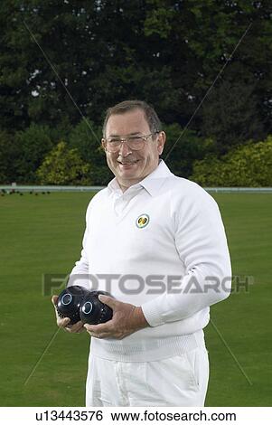 male bowler at green View Large Photo Image Stock Photograph - male bowler at green. Fotosearch