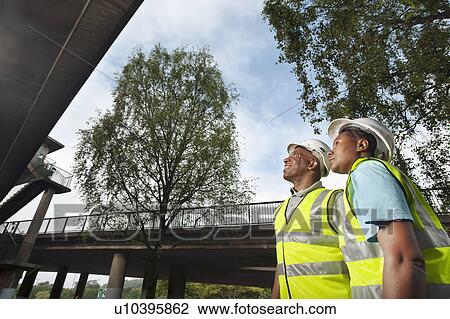 male & female inspecting construction View Large Photo Image Stock Image - male & female inspecting construction. Fotosearch