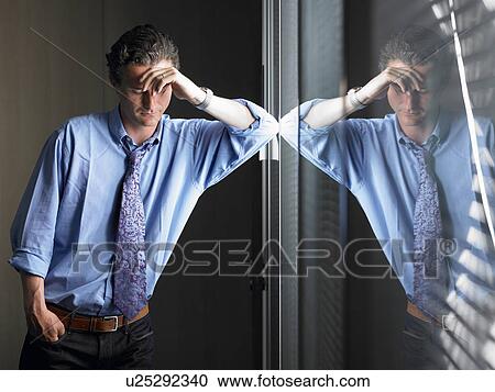 Man against window, thinking View Large Photo Image Stock Image - Man against window, thinking. Fotosearch