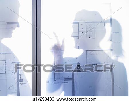 Man and woman behind blue prints View Large Photo Image Stock Photograph - Man and woman behind blue prints. Fotosearch