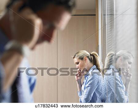 Man and woman on the phone View Large Photo Image Stock Image - Man and woman on the phone. Fotosearch