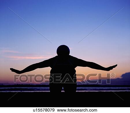 man balancing ball on back View Large Photo Image Stock Photo - man balancing ball on back. Fotosearch