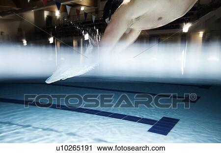 Stock Image - Man diving into a Pool. Fotosearch