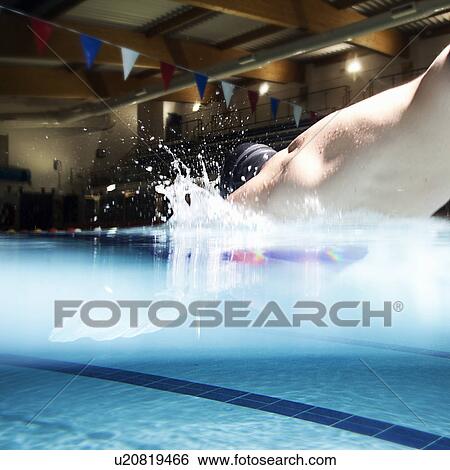 Man diving into a Pool View Large Photo Image Stock Photograph - Man diving into a Pool. Fotosearch