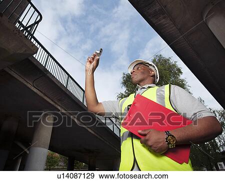 man documenting construction View Large Photo Image Stock Photo - man documenting construction. Fotosearch