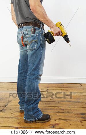 Stock Photo - Man doing DIY. Fotosearch