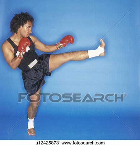 man doing front kick, side view View Large Photo Image Stock Image - man doing front kick, side view. Fotosearch