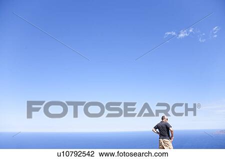 Man in front of ocean View Large Photo Image Stock Image - Man in front of ocean. Fotosearch