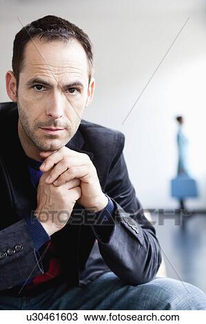 man in front with woman in background View Large Photo Image Stock Image - man in front with woman in background. Fotosearch