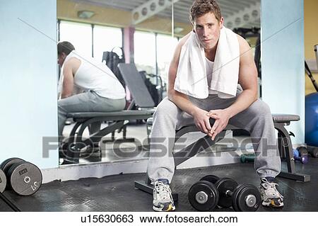 Stock Image - Man in gym. Fotosearch