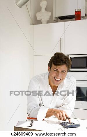 Man paying bills View Large Photo Image Stock Photo - Man paying bills. Fotosearch