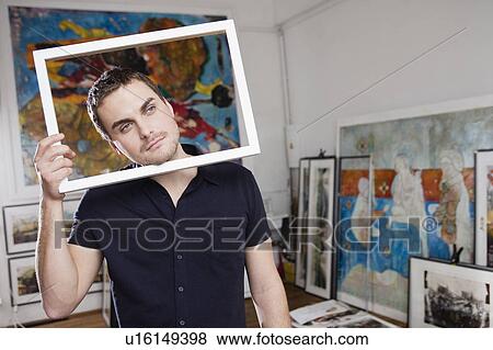 Stock Photo - man playing with frame. Fotosearch