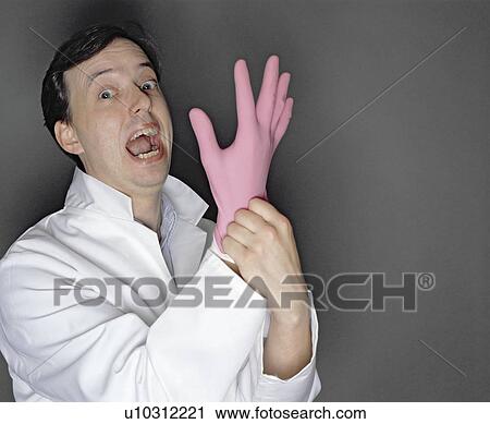 man putting rubber glove on View Large Photo Image Stock Image - man putting rubber glove on. Fotosearch