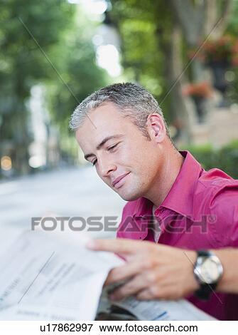 Stock Photo - man reading newspaper. Fotosearch
