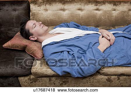 Stock Photo - man relaxing in bath robes. Fotosearch