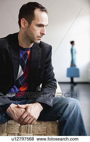 man sitting on basket View Large Photo Image Stock Photo - man sitting on basket. Fotosearch