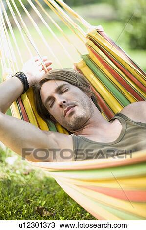 Man sleeping in a hammock View Large Photo Image Stock Image - Man sleeping in a hammock. Fotosearch