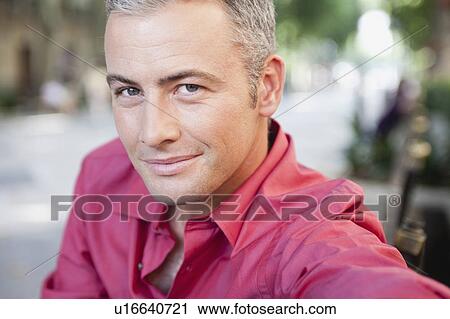 man smiling at viewer View Large Photo Image Stock Image - man smiling at viewer. Fotosearch