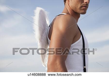 man wearing angel's wings View Large Photo Image Stock Photo - man wearing angel's wings. Fotosearch