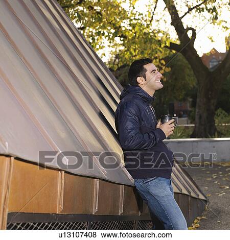 Stock Photo - Man with flask. Fotosearch