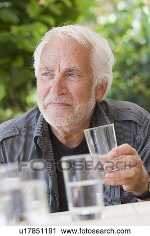 man with glass of water View Large Photo Image Stock Image - man with glass of water. Fotosearch