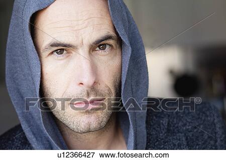 man with hood looking at viewer View Large Photo Image Stock Photo - man with hood looking at viewer. Fotosearch