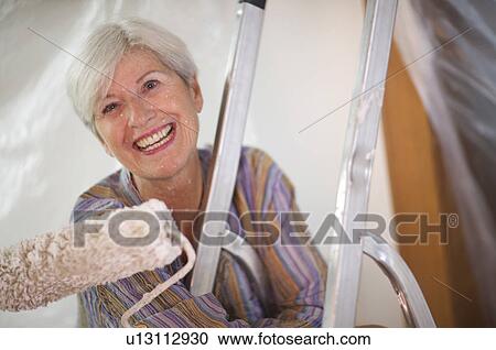 Mature woman doing DIY View Large Photo Image Stock Image - Mature woman doing DIY. Fotosearch