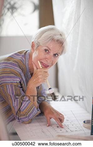 Mature woman doing DIY View Large Photo Image Stock Image - Mature woman doing DIY. Fotosearch