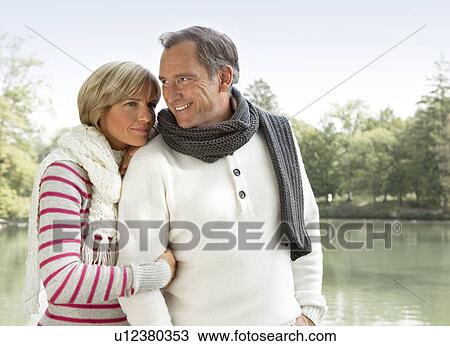 Middle aged couple at a lake View Large Photo Image Stock Image - Middle aged couple at a lake. Fotosearch