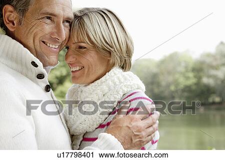 Middle aged couple hugging View Large Photo Image Stock Image - Middle aged couple hugging. Fotosearch