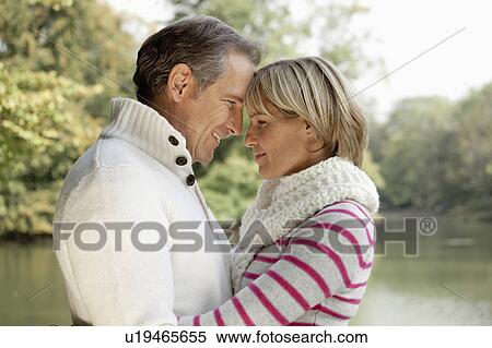 Middle aged couple hugging View Large Photo Image Stock Photography - Middle aged couple hugging. Fotosearch