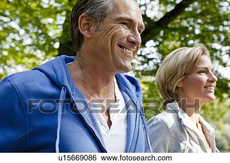 Stock Photograph - Middle aged couple jogging. Fotosearch