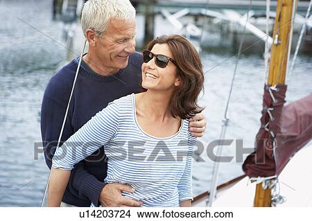 Middle aged couple on an old boat View Large Photo Image Picture - Middle aged couple on an old boat. Fotosearch