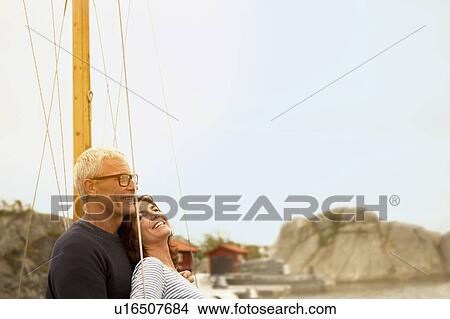 Middle aged couple on an old boat View Large Photo Image Picture - Middle aged couple on an old boat. Fotosearch