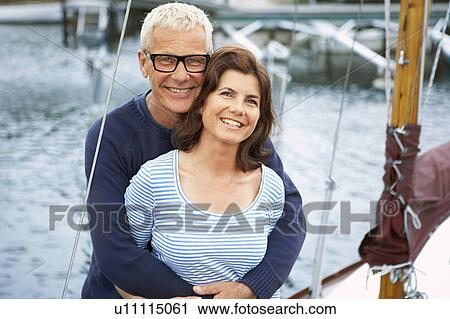 Middle aged couple on an old boat View Large Photo Image Stock Image - Middle aged couple on an old boat. Fotosearch
