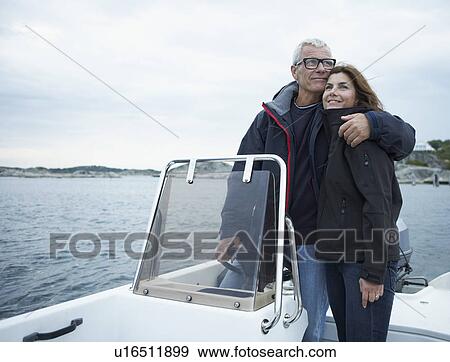 Middle aged couple on motor boat View Large Photo Image Stock Photo - Middle aged couple on motor boat. Fotosearch