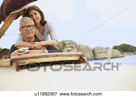 Middle aged couple on old boat View Large Photo Image Stock Photo - Middle aged couple on old boat. Fotosearch