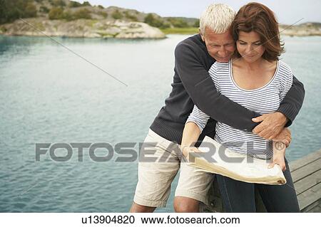 Middle aged couple with map View Large Photo Image Stock Image - Middle aged couple with map. Fotosearch